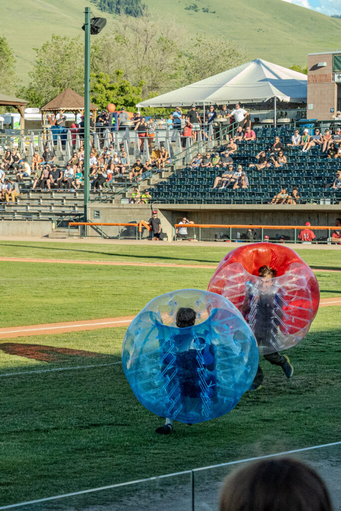 Kids inside big rubber balls