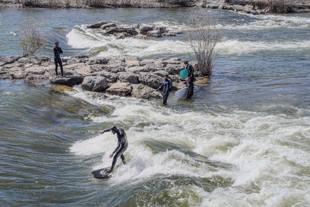 Surfer on the Clark Fork River in downtown Missoula, Montana